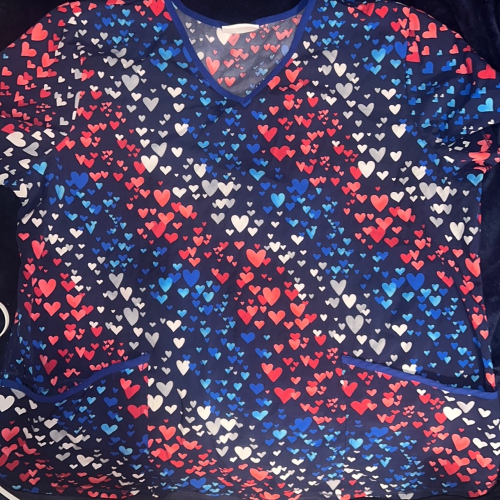 Scrub star, red, white, and blue heart top